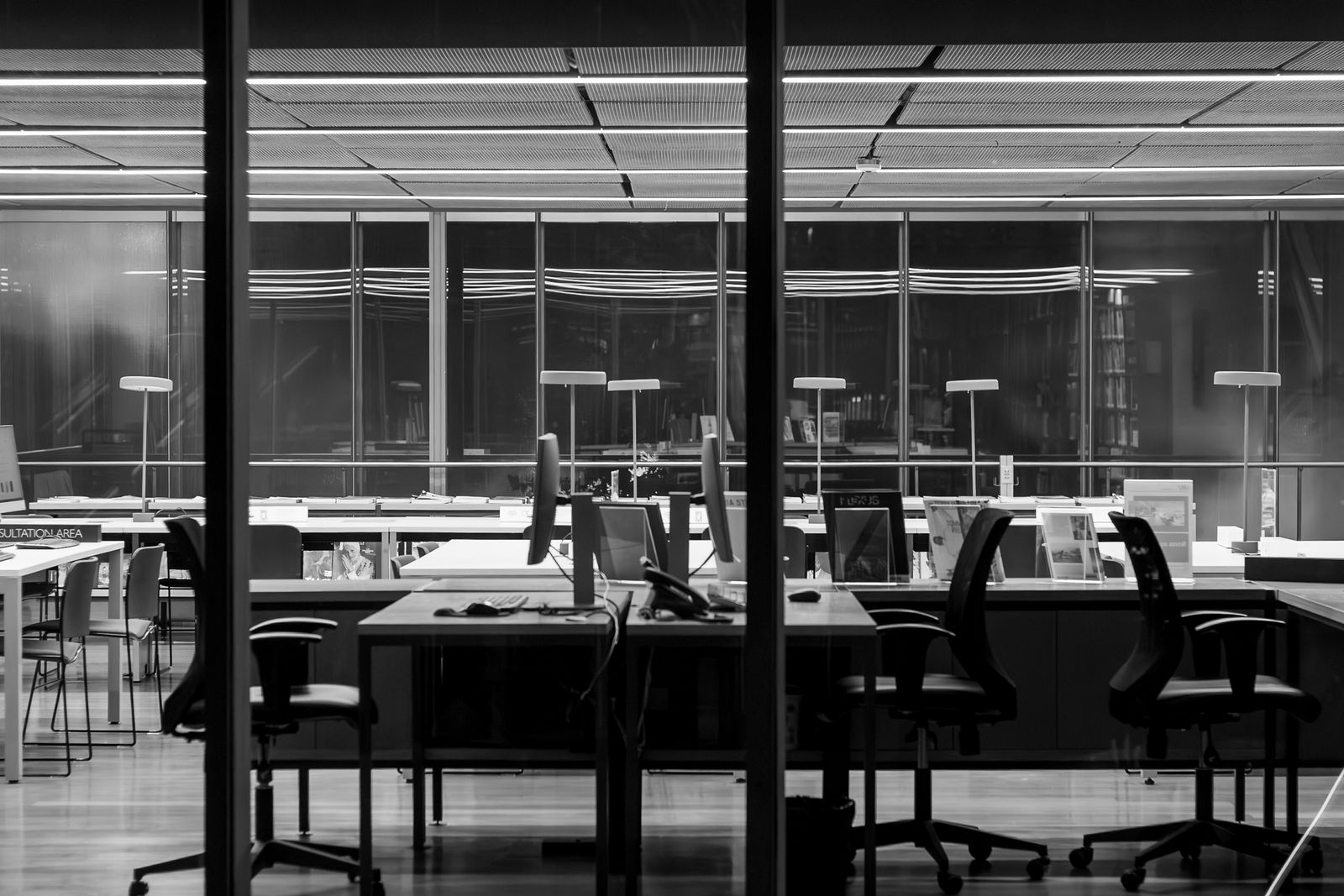 An empty office after hours, in black and white